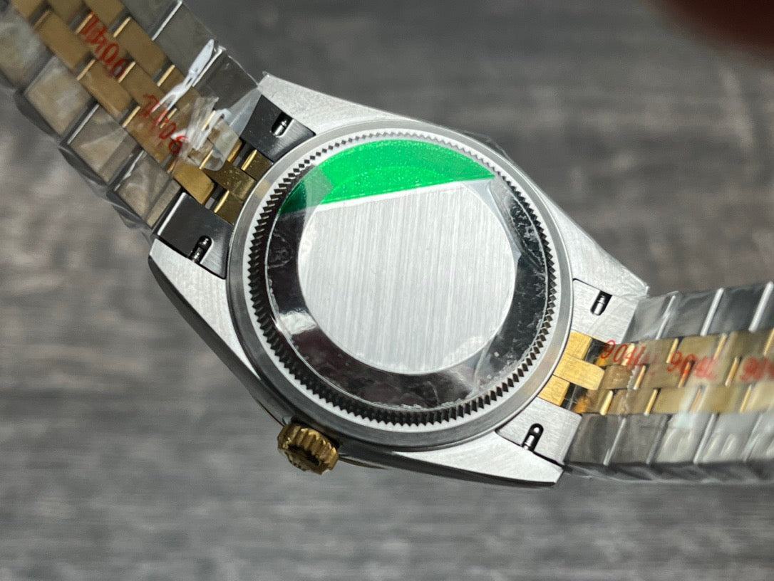 Rolex Datejust 31mm green dial with gold accents