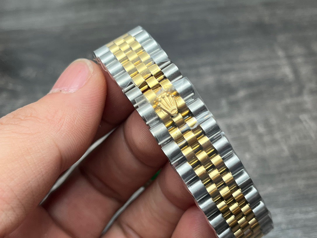 Rolex Datejust 31mm green dial with gold accents