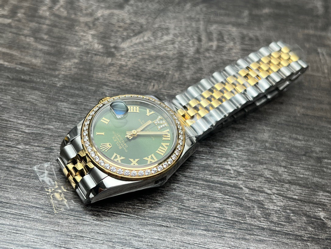 Rolex Datejust 31mm green dial with gold accents