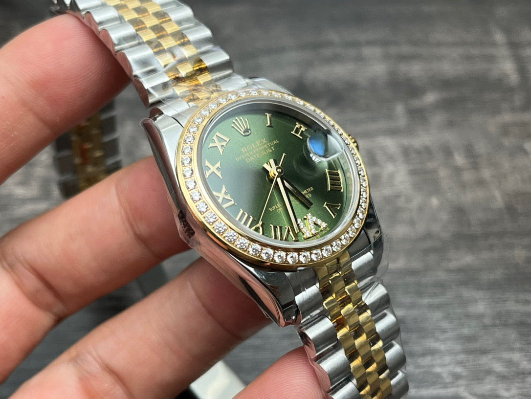 Rolex Datejust 31mm green dial with gold accents
